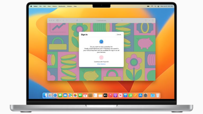 Auf einem aufgeklappten MacBook wird der Hinweis zur Anmeldung via Passkey angezeigt.